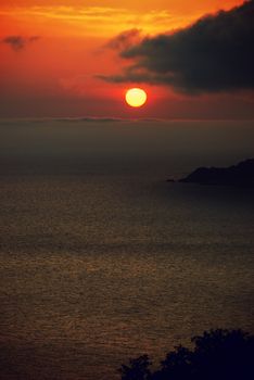 Sunset. A picturesque sunset with fantastic foggy under mountain