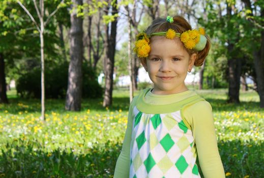 child with flower wreath on head