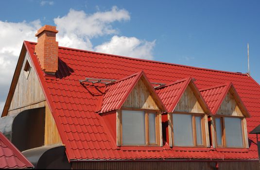 Red roof. A cottage constructed highly in mountains