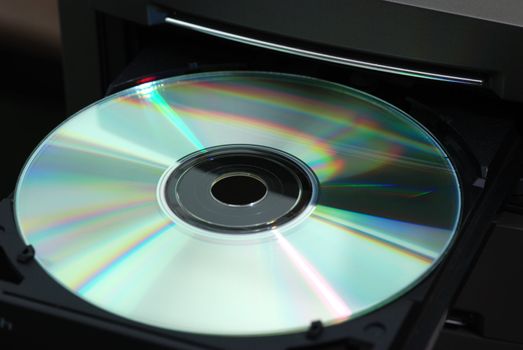 Disk in the  drive. A photo close up CD of a disk