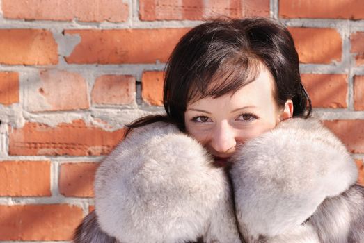 The woman in a fur coat. A fur coat from arctic fox