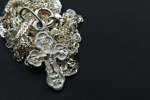Silver chain with a dagger. The crucifixion