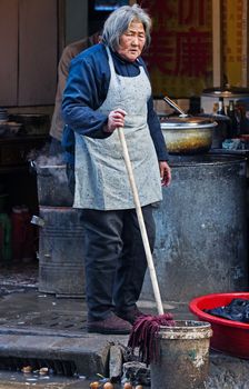 Old Chinese woman in Shanghai street