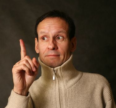 Portrait of the adult of the man with the lifted finger