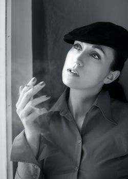 Woman with a cigarette in cap