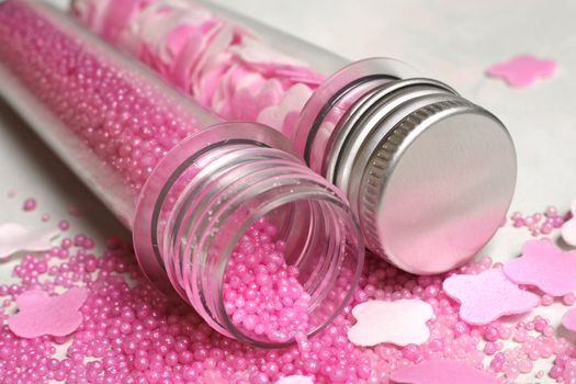 Bottles with pink salt for baths and silver cover