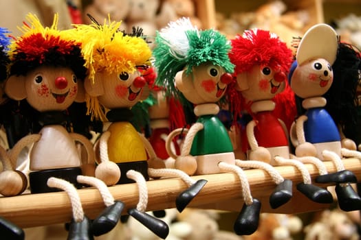 Five wooden toys of different colors