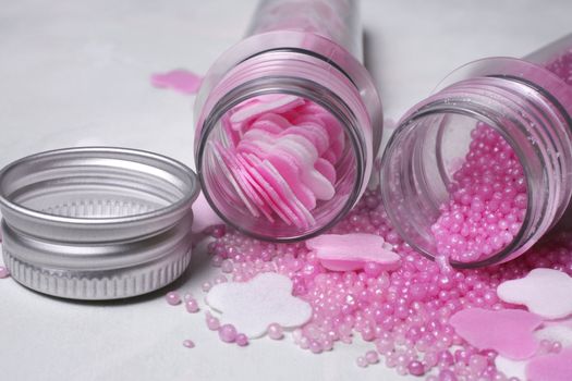 Bottles with pink salt for baths and silver cover