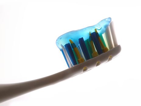 Tooth-brush with tooth-paste close-up isolated in white