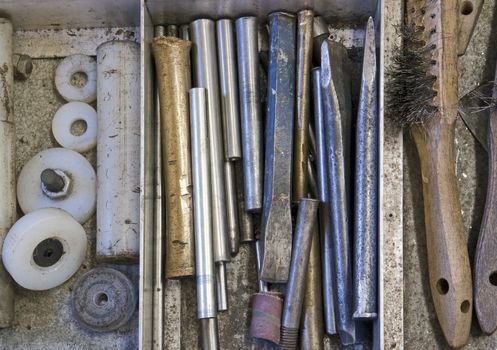 tools in drawer - chisel, punch, prick punch, steel brush