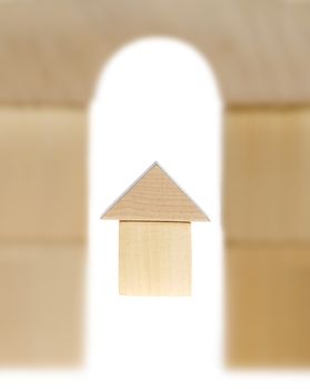 The wooden house. Children's toys - wooden cubes. It is isolated on a white background