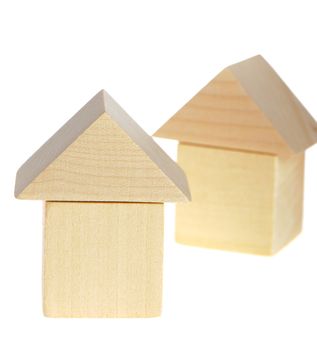 The wooden house. Children's toys - wooden cubes. It is isolated on a white background