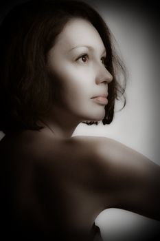 Portrait of the women. The pretty girl in profile. Monochrome toning