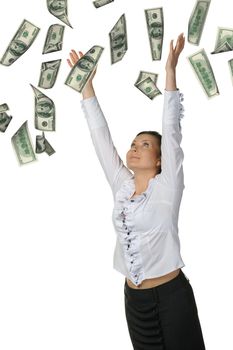 The woman and is a lot of money falling from above. It is isolated on a white background.