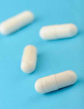 set capsules on blue background. Photo closeup