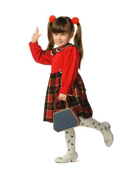 The little girl in a red dress. It is isolated on a white background