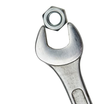 Wrench with a nut. It is isolated on a white background