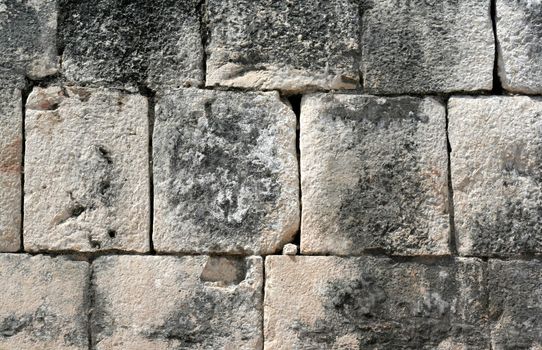 A closeup of a stone wall at Chichen Itza.