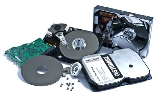Parts of hard drive on white background