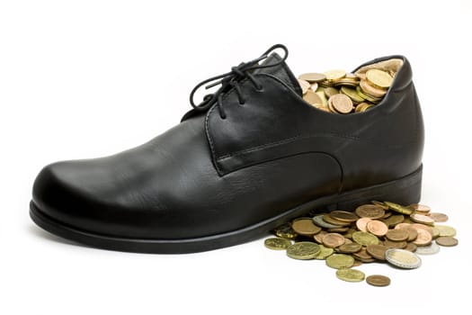 euro coins in and around black leather business shoe.