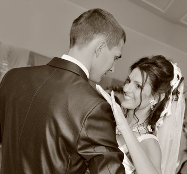 Dancing newly-married couple. The first wedding dance - processing in monochrome