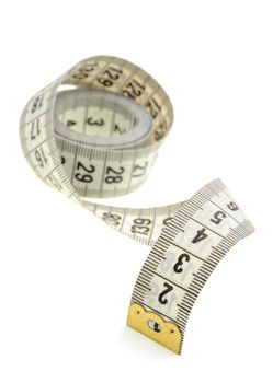 Measuring tape of the tailor white color. It is isolated on a white background