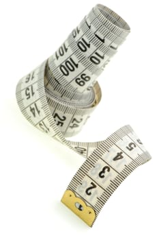 Measuring tape of the tailor white color. It is isolated on a white background