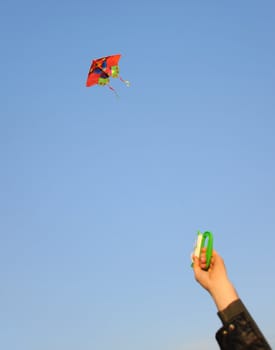 Kite. A colourful kite flying to the dark blue sky