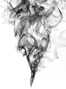 black color smoke from white background  . The abstract image of a smoke on a white background