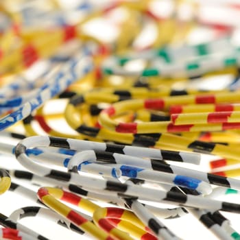 Color paper clips. Office subject it is isolated on a white background