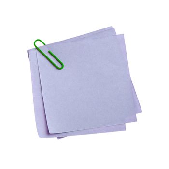 Blue paper note with green clinch. It is attached red pin on a white background