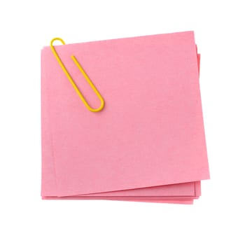 Red paper note with yellow clinch. It is attached red pin on a white background