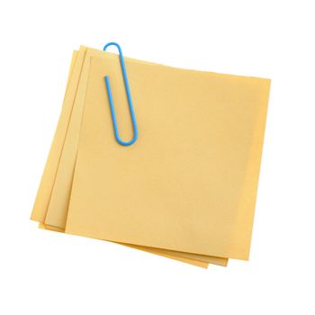 Paper note with green clinch. It is attached red pin on a white background