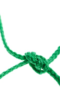 Knot on a cord. Isolated on a white background