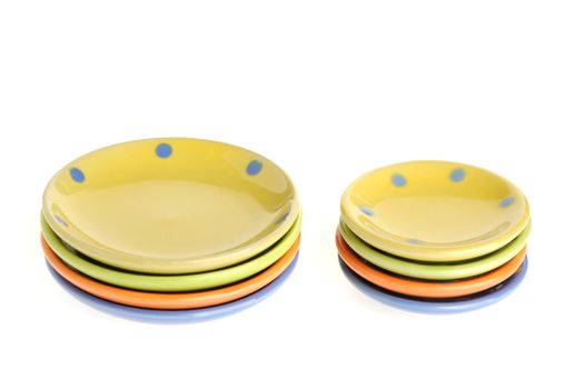 Color cups. Tiny utensils it is isolated on a white background