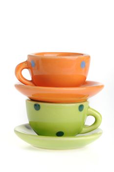 Color cups. Tiny utensils it is isolated on a white background