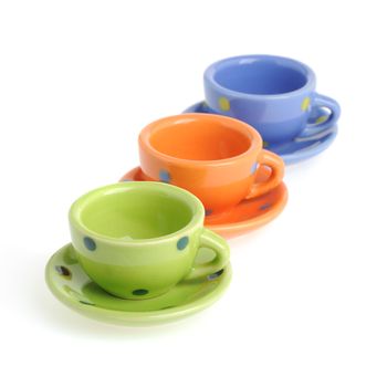 Color cups. Tiny utensils it is isolated on a white background