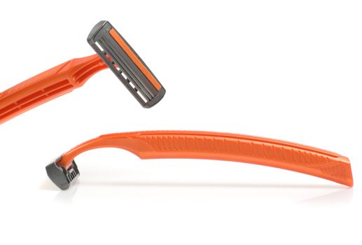The disposable razor. The shaving machine tool isolated on a white background