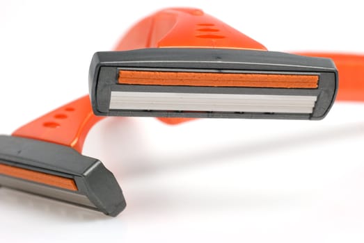 The disposable razor. The shaving machine tool isolated on a white background