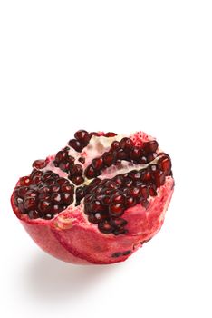 Pomegranate. Ripe fruit. It is isolated on a white background