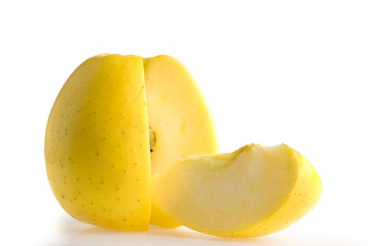 cut yellow apple. It is isolated on a white background