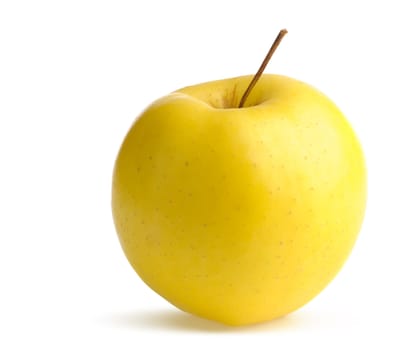 Ripe yellow apple. It is isolated on a white background