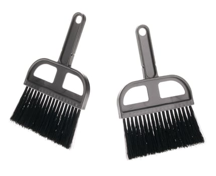 Brush. The tool for cleaning it is isolated on a white background