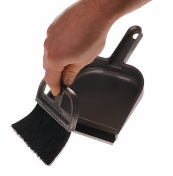 Brush and dustpan. The tool for cleaning it is isolated on a white background
