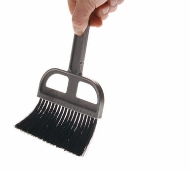 Brush in man hand. The tool for cleaning it is isolated on a white background