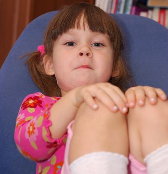 The thoughtful little girl. The three-year child of the European nationality