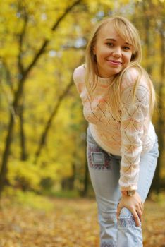 The girl on a background autumn forest. The blonde, 24 years