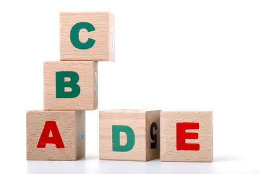 The alphabet. Letters drawn on wooden cubes. A children's toy