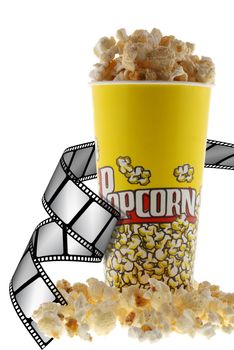 Popcorn and film. Grains of corn are isolated on a white background