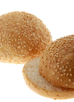 bun for sandwich cut . A bakery product strewed by grains